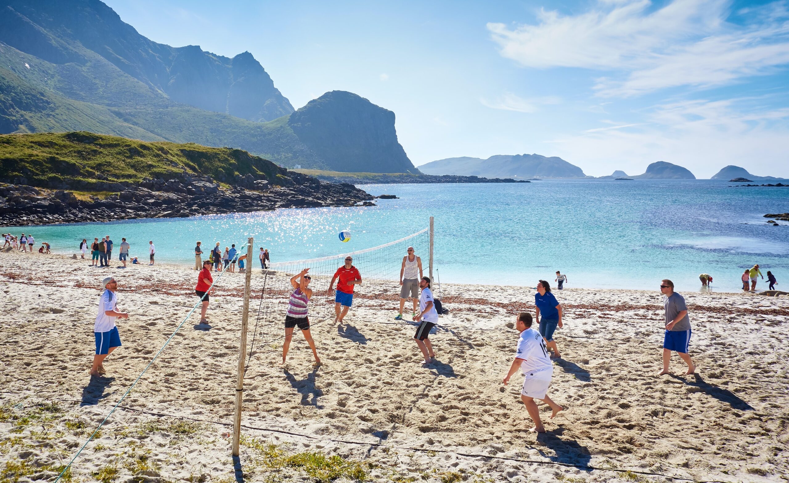 people playing beach volleyball